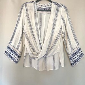 This beautiful blouse is light weight with a flattering cut on every body type.